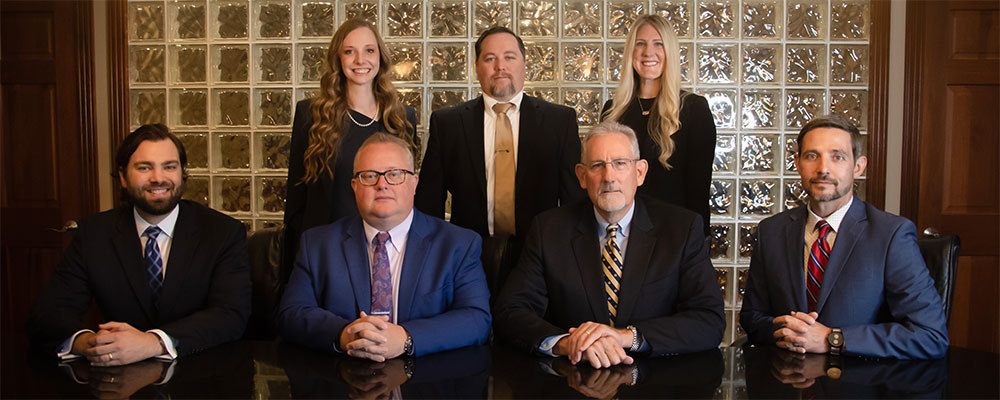 group Photo of attorneys at Roberts Wooten & Zimmer LLC